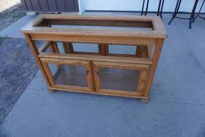 lot 123 image: TV Stand with glass top and doors 44 L x 14 x 30T