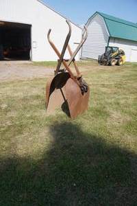 lot 106 image: Two steel grain scoops on wheels-wood handles