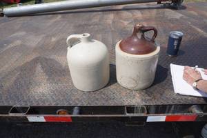 lot 132 image: 2 Stone shoulder jugs-1 with hairline crack