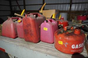 lot 213 image: Eight poly and metal gas cans