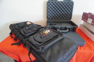 lot 49 image: Two gun cases, one hard pistol case