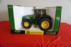 lot 57 image: John Deere 7720 tractor Dealer Edition-new
