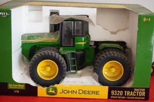lot 65 image: John Deere 9320 Tractor and plow