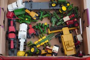 lot 110 image: Flat of miniature tractors, semi, implements