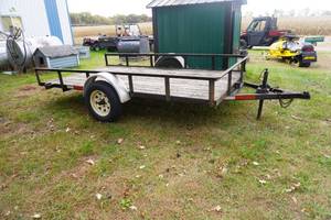 lot 200 image: Two wheel tilting trailer,wood deck 68 x 12