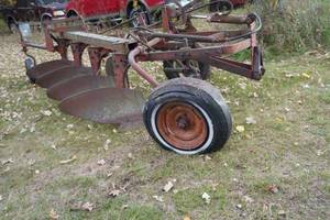 lot 195 image: Four Bottom plow-16 Bad tires & no hitch