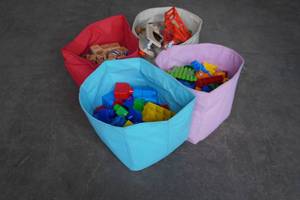 lot 283 image: Four bags of toys, Duplos, wood blocks, etc...