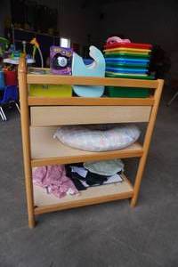 lot 291 image: Changing table with bibs, totes etc