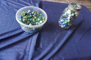 lot 332 image: Two containers of marbles