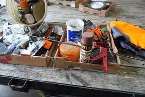 lot 355 image: Ford hitch cover, coupler, garden tools, chain saw chaps