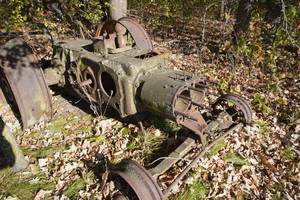 lot 180 image: Old John Deere D and plow, mostly lawn ornament