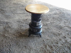 lot 70 image: Perfection Oil heater-round wood table top