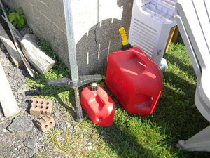 lot 222 image: 2) Poly gas cans & Pogo stick