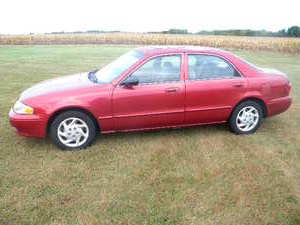 lot 95 image: 06 Mazda 626 Four door 176,xxx mi automatic Driven out, starts and drives