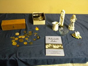 lot 699 image: Coins, keys, figures, book