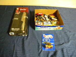 lot 702 image: Hot Wheels cars, Guy Fieri knives