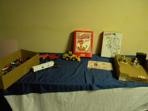 lot 714 image: Barbies, toy cars and loader