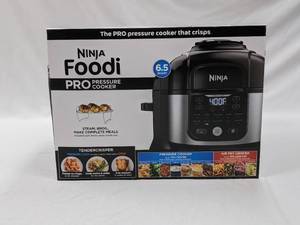 lot 60 image: Pressure Cooker Ninja Foodi Pro and cook book