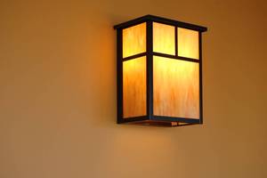 lot 19 image: Two Wall Sconces matching the booth lamps