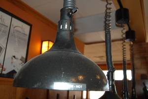 lot 10 image: Four Black heat lamps with track