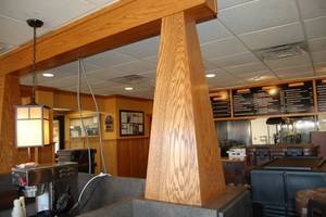 lot 11 image: Two wooden columns with header
