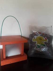 lot 39 image: Orange Bird House with Seeds - Donated by Cal Kangas