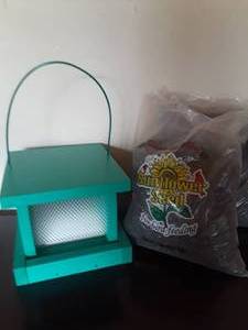 lot 38 image: Green Bird House with Seeds -  Donated by Cal Kangas