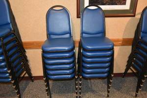 lot 86 image: 12 stackable blue padded chairs