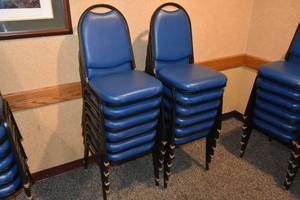 lot 87 image: 12 stackable blue padded chairs
