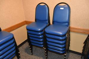 lot 88 image: 12 stackable blue padded chairs