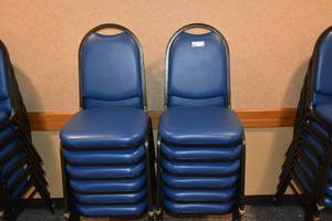 lot 91 image: 12 stackable blue padded chairs