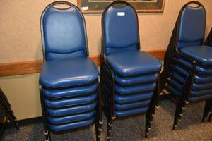 lot 96 image: 12 stackable blue padded chairs