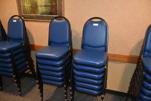 lot 95 image: 12 stackable blue padded chairs