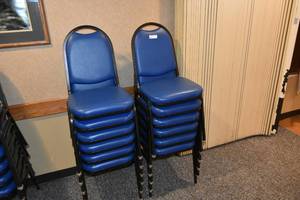 lot 97 image: 12 stackable blue padded chairs