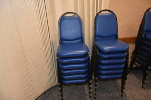 lot 101 image: 12 stackable blue chairs
