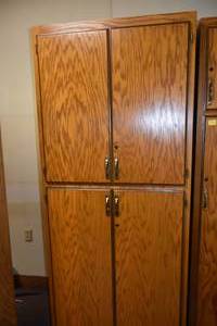 lot 303 image: 7 Tall Four door cabinet wshelves