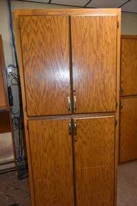 lot 304 image: 7 Tall Four door cabinet wshelves