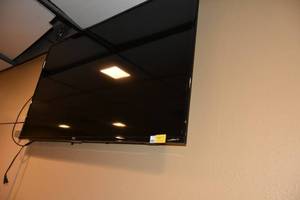 lot 307 image: Roko TCL 56 Flat screen TV wwall mount
