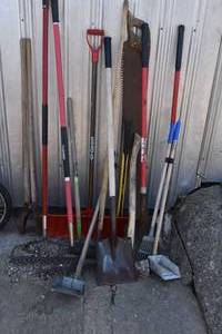 lot 15 image: Tools, shovels, axe, old saw etc.