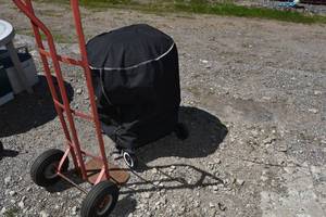 lot 23 image: Backyard grill, cover & 2 wheeler