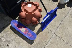 lot 35 image: Skate board, plant stand, shovel