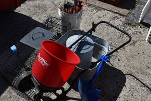 lot 54 image: Fert spreader, fishing rods and tip-ups in pail etc...