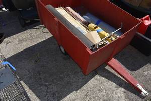lot 56 image: Lawn trailer, sprinkler, tarp