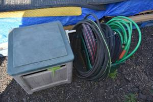 lot 74 image: Tub of garden hose & hose reel