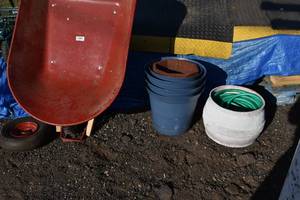 lot 75 image: Wheel barrow, flower pots, hose