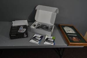lot 280 image: Captioned phone, clock, phone