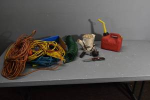 lot 298 image: Electric cords, hose, gas can etc.