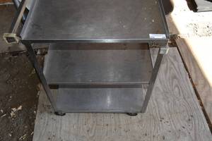 lot 84 image: SS three shelf roller cart