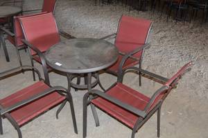 lot 89 image: Patio table with four red chairs (seat has some separations)