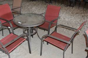 lot 90 image: Patio table with four red chairs (seat has some separations)